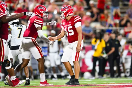 Kenneth Almendares high fives Trey Fite October 12, 2024 Louisiana vs Appalachian State Football in Lafayette, LA at Cajun Field. Final score Louisiana 34 App State 24. Photo by Benjamin R. Massey/Ragin’ Cajun Athletics