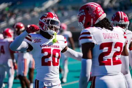 Jalen Clark and Jaden Dugger handshake Pregame warmups October 19, 2024 Louisiana @ Coastal Carolina Football in Conway, SC at Brooks Stadium. Final score Louisiana 34 CCU 24. Photo by Benjamin R. Massey/Ragin’ Cajun Athletics