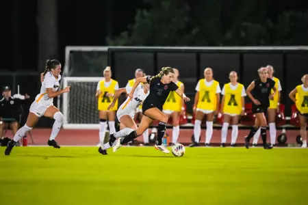 Tatum Beck dribbles up the pitch