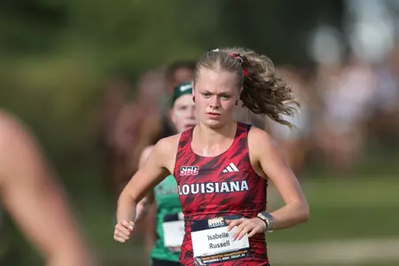 Isabelle Russell runs at the SBC Championships