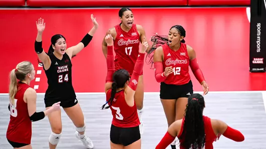 VB Hicks and Yamamoto in Group Celebration vs. FAMU 09.20.24