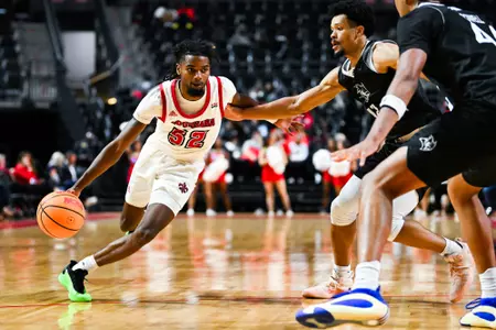 Michael Thomas dribbles November 19, 2024 Louisiana vs Rice Men's Basketball in Lafayette, LA at the Cajundome. Final score Louisiana 61 Rice 83. Photo by Benjamin R. Massey/Ragin’ Cajuns Athletics