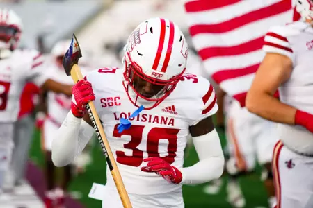 Ethan Veal with an axe for Run out October 29, 2924 Louisiana vs Texas State Football in San Marcos, Texas at UFCU Stadium. Final score Louisiana 23 TXST 17. Photo by Benjamin R. Massey/Ragin’ Cajun Athletics
