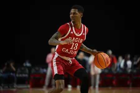 Christian Wright dribbles the ball against Kent State