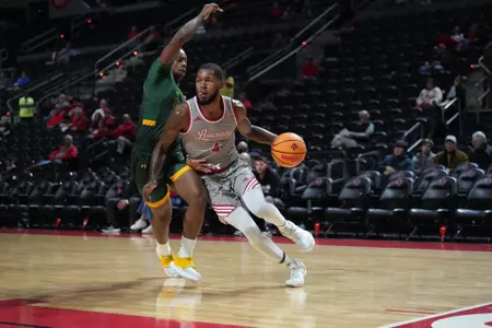 Kyndall Davis drives to the basket against SLU