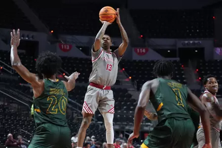 Christian Wright attempts a jump shot vs SLU