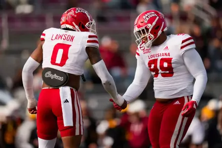 Jordan Lawson celebrates sack with Ashton Wright November 30, 2024 Louisiana @ ULM Football in Monroe, LA at Malone Stadium. Final score Louisiana 37 Louisiana-Monroe 23. Photo by Benjamin R. Massey/Ragin’ Cajuns Athletics