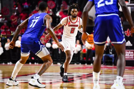 Michael Thomas dribbles February 7, 2024 Louisiana vs Georgia State Men's Basketball in Lafayette, LA at the Cajundome. Final score Louisiana 69 Georgia State 78. Photo by Benjamin R. Massey/Ragin Cajun Athletics