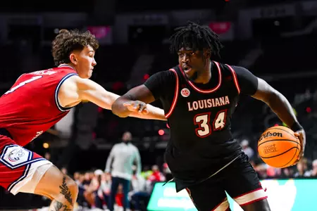 Hosana Kitenge dribbles February 3, 2024 Louisiana vs South Alabama Men's Basketball in Lafayette, LA at the Cajundome. Final score Louisiana 80 South Alabama 60. Photo by Benjamin R. Massey/Ragin Cajun Athletics
