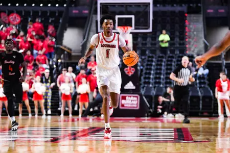 Joe Charles dribbles February 11, 2024 Louisiana vs Bowling Green Men's Basketball in Lafayette, LA at the Cajundome. Final score Louisiana 86 Bowling Green 60. Photo by Benjamin R. Massey/Ragin Cajun Athletics