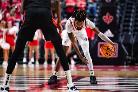 Michael Thomas dribbles February 11, 2024 Louisiana vs Bowling Green Men's Basketball in Lafayette, LA at the Cajundome. Final score Louisiana 86 Bowling Green 60. Photo by Benjamin R. Massey/Ragin Cajun Athletics