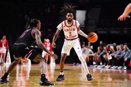 Michael Thomas dribbles February 28, 2024 Louisiana vs Troy Men's Basketball in Lafayette, LA at the Cajundome. Final score Louisiana 73 Troy 87. Photo by Benjamin R. Massey/Ragin Cajun Athletics