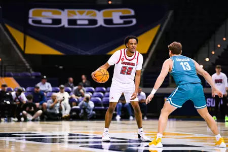 Kentrell Garnett dribbles March 7, 2024 Louisiana vs Coastal Carolina Men's Basketball in Pensacola, FL at the Pensacola Bay Center. Final score Louisiana 80 Coastal Carolina 66. Photo by Benjamin R. Massey/Ragin Cajun Athletics