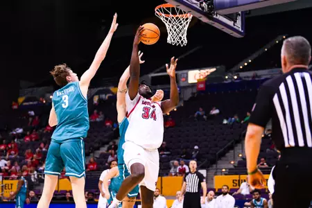Hosana Kitenge lay up March 7, 2024 Louisiana vs Coastal Carolina Men's Basketball in Pensacola, FL at the Pensacola Bay Center. Final score Louisiana 80 Coastal Carolina 66. Photo by Benjamin R. Massey/Ragin Cajun Athletics
