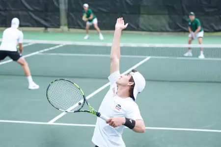 Sacha Grandvincent serves in doubles against Charlotte