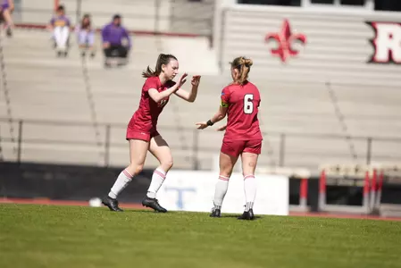 Megan Bradley and Lucy Ortiz celebrate a goal during the spring season
