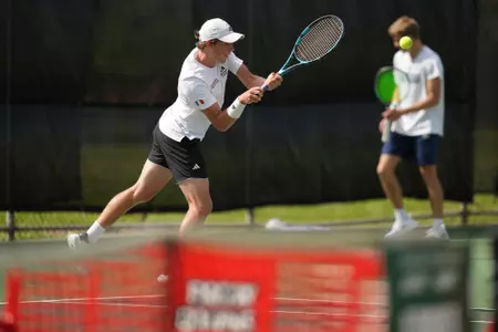 Leonard Tramolay returns a ball on a backhand