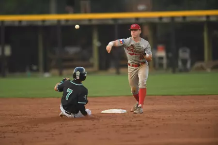 John Taylor turns a double play in Friday's 9-1 loss to Coastal Carolina