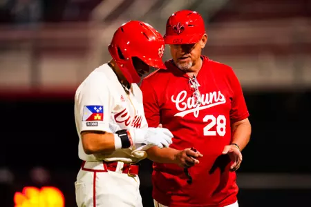 Matt Deggs talks to Maddox Mandino March 26, 2024 Louisiana vs Grambling State Baseball in Russo Park at M.L. "Tigue" Moore Field. Final Score Louisiana 12 Grambling 4. Photo by Benjamin R. Massey/Ragin’ Cajun Athletics