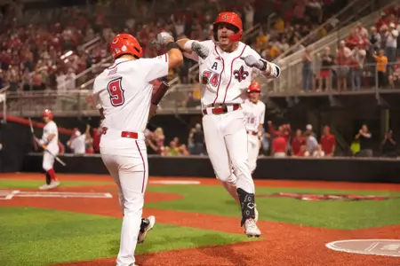 Kyle DeBarge celebrates his three-run homer in a 3-2 win over Southern Miss