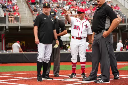 Head Coach, Matt Deggs talks to Southern Miss head coach Christian Ostrander April 26, 2024 Louisiana vs Southern Miss Baseball Game 1 in Russo Park at M.L. "Tigue" Moore Field. Final Score Louisiana 3 USM 2. Photo by Benjamin R. Massey/Ragin’ Cajun Athletics