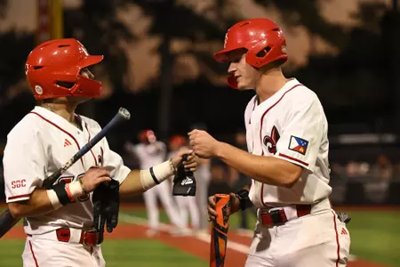 Conor Higgs and Josh Alexander celebrate during Louisiana's 4-1 win over ULM