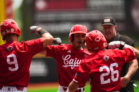Kyle DeBarge celebrates home run with teammates April 28, 2024 Louisiana vs Southern Miss Baseball Game 3 in Russo Park at M.L. "Tigue" Moore Field. Final Score Louisiana 13 USM 7. Photo by Hunter Neel/Ragin’ Cajun Athletics