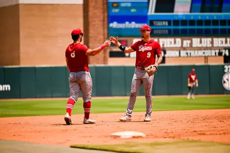 Lee Amedee (8) and Duncan Pastore (9) during practice on Thursday at the NCAA Bryan-College Station Regional