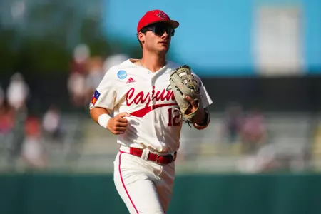 Caleb Stelly walks back to the dugout May 31, 2024 Louisiana vs University of Texas Baseball in the NCAA Baseball Regional at Olsen Field at Blue Bell Park in College Station, Texas Final Score Louisiana 5 UT 12. Photo by Benjamin R. Massey/Ragin’ Cajun Athletics