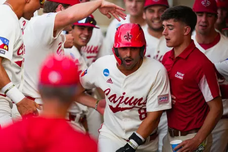 Lee Amedee celebrates home run with teammates May 31, 2024 Louisiana vs University of Texas Baseball in the NCAA Baseball Regional at Olsen Field at Blue Bell Park in College Station, Texas Final Score Louisiana 5 UT 12. Photo by Benjamin R. Massey/Ragin’ Cajun Athletics