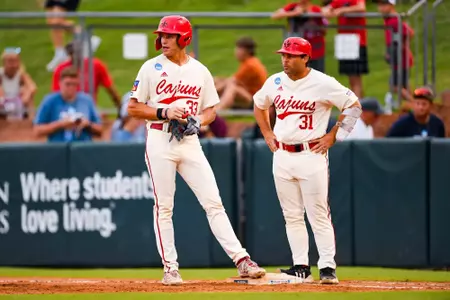 Conor Higgs stands on first base with Zach LaFleur May 31, 2024 Louisiana vs University of Texas Baseball in the NCAA Baseball Regional at Olsen Field at Blue Bell Park in College Station, Texas Final Score Louisiana 5 UT 12. Photo by Benjamin R. Massey/Ragin’ Cajun Athletics