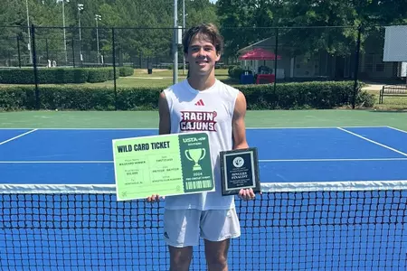 Mason Landreth poses after reaching the finals of a USTA event