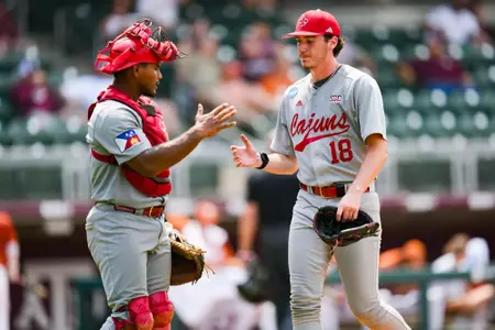Chase Morgan and Jose Torres high five June 2, 2024 Louisiana vs Texas Baseball in the NCAA Baseball Regional at Olsen Field at Blue Bell Park in College Station, Texas. Final Score Louisiana 10 UT 2. Photo by Benjamin R. Massey/Ragin’ Cajun Athletics