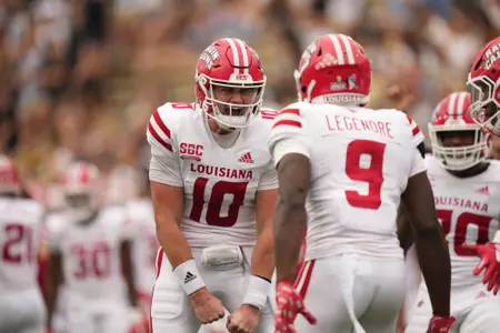 Ben Wooldridge celebrates with Lance Legendre after a third-quarter touchdown in Saturday's 41-38 win at Wake Forest