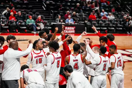 Cajun men's basketball in the huddle against ULM