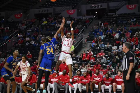Kentrell Garnett shoots over a McNeese defender