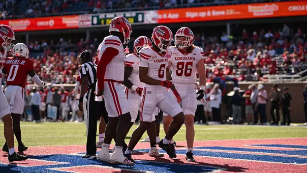 Shelton Sampson celebrates with teammates after his first of two touchdown receptions in Louisiana's 31-22 win at South Alabama