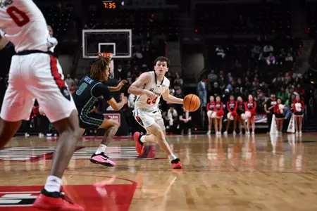 Milan Mejia drives around Tulane's KJ Greene in the first half of Louisiana's game against Tulane