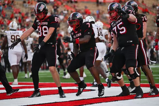 Caden Jensen (88), Bill Davis (7) and Kaden Moreau (75) show off their dance moves after Davis' 12 yard TD run in the second quarter of Saturday's 42-39 win over Texas State