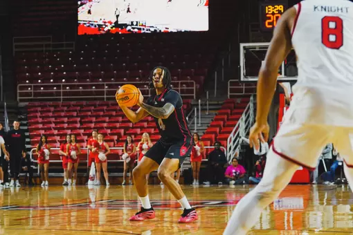 Dariyus Woodson sizes up a 3-pointer in Wednesday's non-conference contest against Lamar in the Neches Federal Credit Union Arena