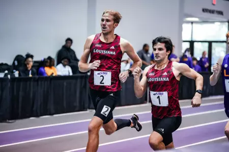 Joe Patterson and Louden Boudreaux run at the Purple Tiger Invite