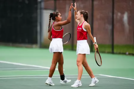 Angelique Berrat and Jenaila Prulla high five February 18, 2025 Louisiana vs. McNeese Women’s Tennis at Cajun Courts in Lafayette, LA. Final score POSTPONED. Photo by Benjamin R. Massey/Ragin’ Cajuns Athletics