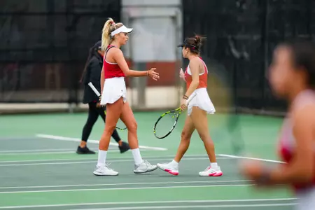 Kamea Medora and Nina Krecklenberg high five February 18, 2025 Louisiana vs. McNeese Women’s Tennis at Cajun Courts in Lafayette, LA. Final score POSTPONED. Photo by Benjamin R. Massey/Ragin’ Cajuns Athletics