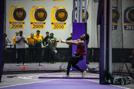 Oliver Jack competes in the weight throw at the Purple Tiger Invite