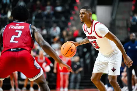 Christian Wright dribbles February 1, 2025 Louisiana vs South Alabama Men's Basketball in Lafayette, LA at the Cajundome. Final score Louisiana 58 USA 62. Photo by Benjamin R. Massey/Ragin’ Cajuns Athletics