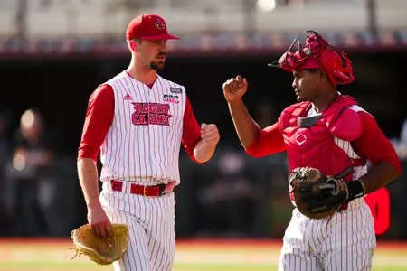 JR Tollett and Jose Torres high five after an inning March 15, 2025 Louisiana vs Troy Baseball Game 2 in Russo Park at M.L. "Tigue" Moore Field. Final Score Louisiana 5 Troy 8. Photo by Benjamin R. Massey/Ragin’ Cajuns Athletics