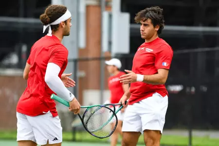 William Jade and Oriol Fillat Gimenez high five April 6, 2025 Louisiana vs. Troy Men’s Tennis at Cajun Courts in Lafayette, LA. Final score Louisiana 3 Troy 4. Photo by Benjamin R. Massey/Ragin’ Cajuns Athletics