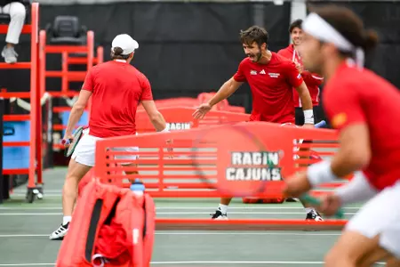 Samuel Kyjaci celebrates with Leonard Tramolay April 6, 2025 Louisiana vs. Troy Men’s Tennis at Cajun Courts in Lafayette, LA. Final score Louisiana 3 Troy 4. Photo by Benjamin R. Massey/Ragin’ Cajuns Athletics