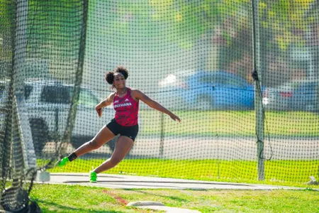 Kimola Hines competes in the discus