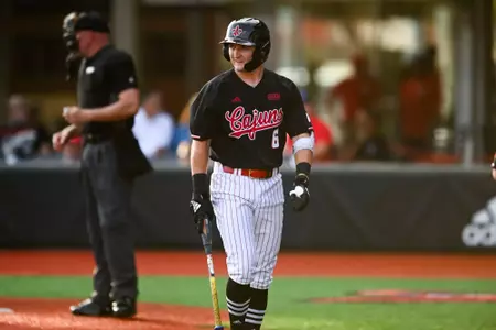 Mark Collins walks to the dugout May 15, 2025 Louisiana vs Arkansas State Baseball Game 1 in Russo Park at M.L. "Tigue" Moore Field. Final Score Louisiana 0 Arkansas State 3. Photo by Benjamin R. Massey/Ragin’ Cajuns Athletics